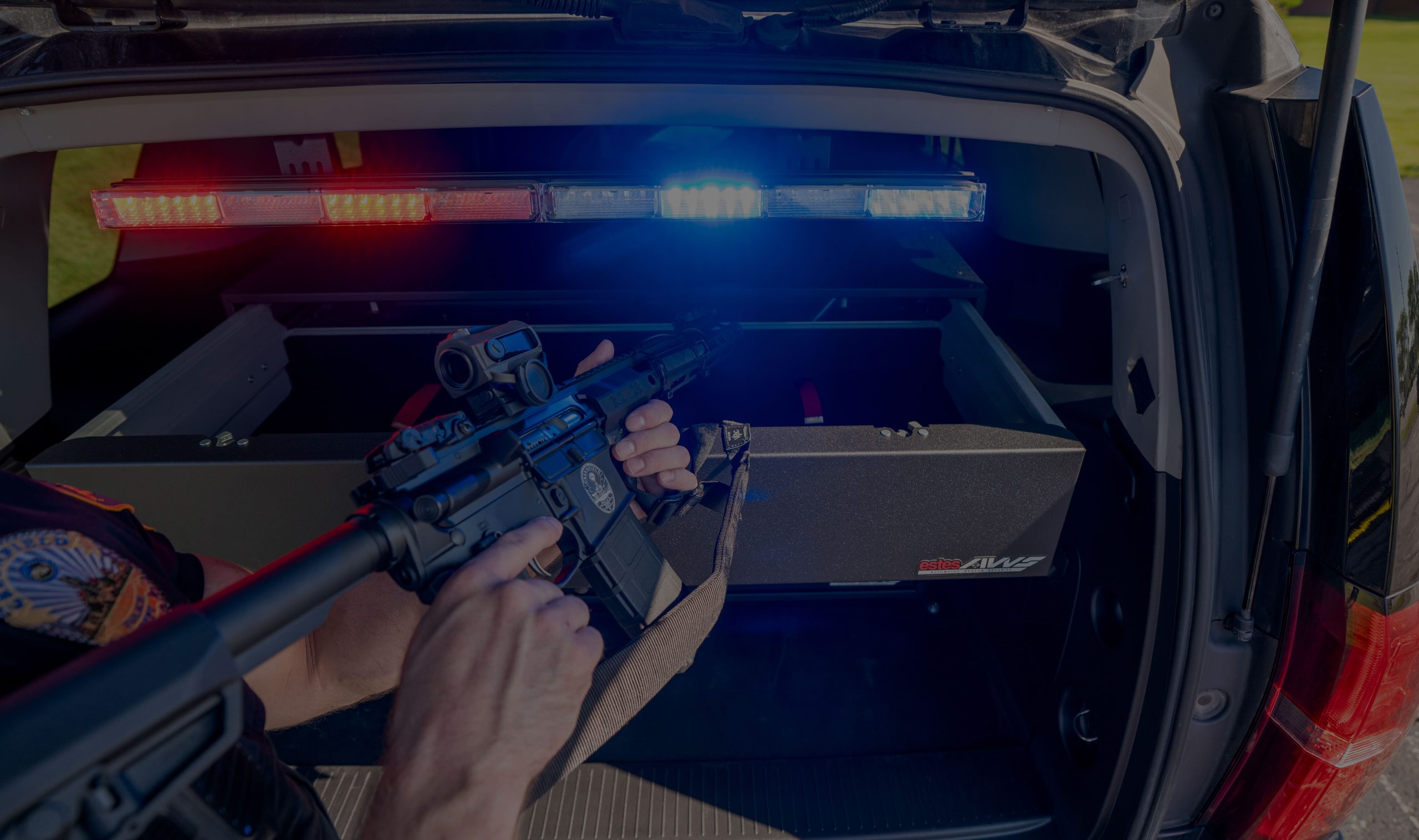 Officer removing weapon from AWS weapon locker